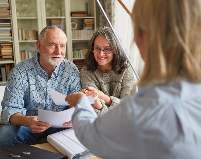 Senior couple getting advice on mobility services