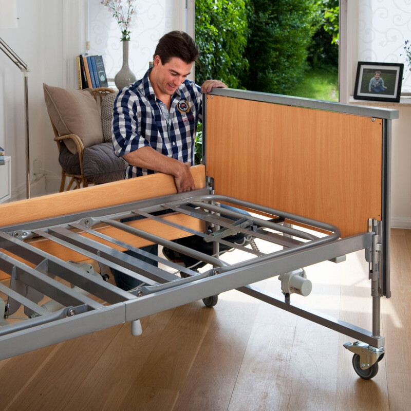 Man putting a reclining bed together