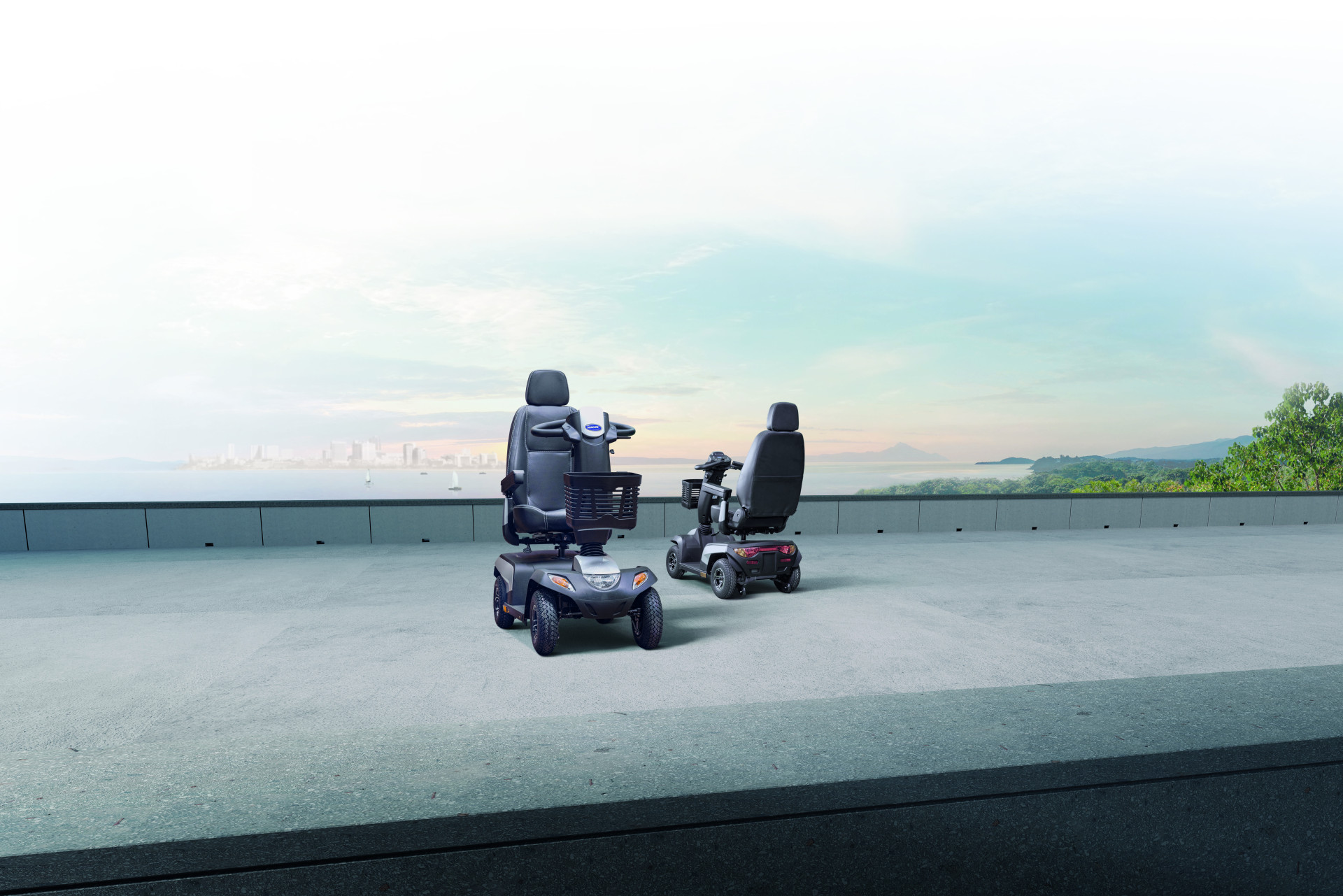 Two mobility scooters by a sea background